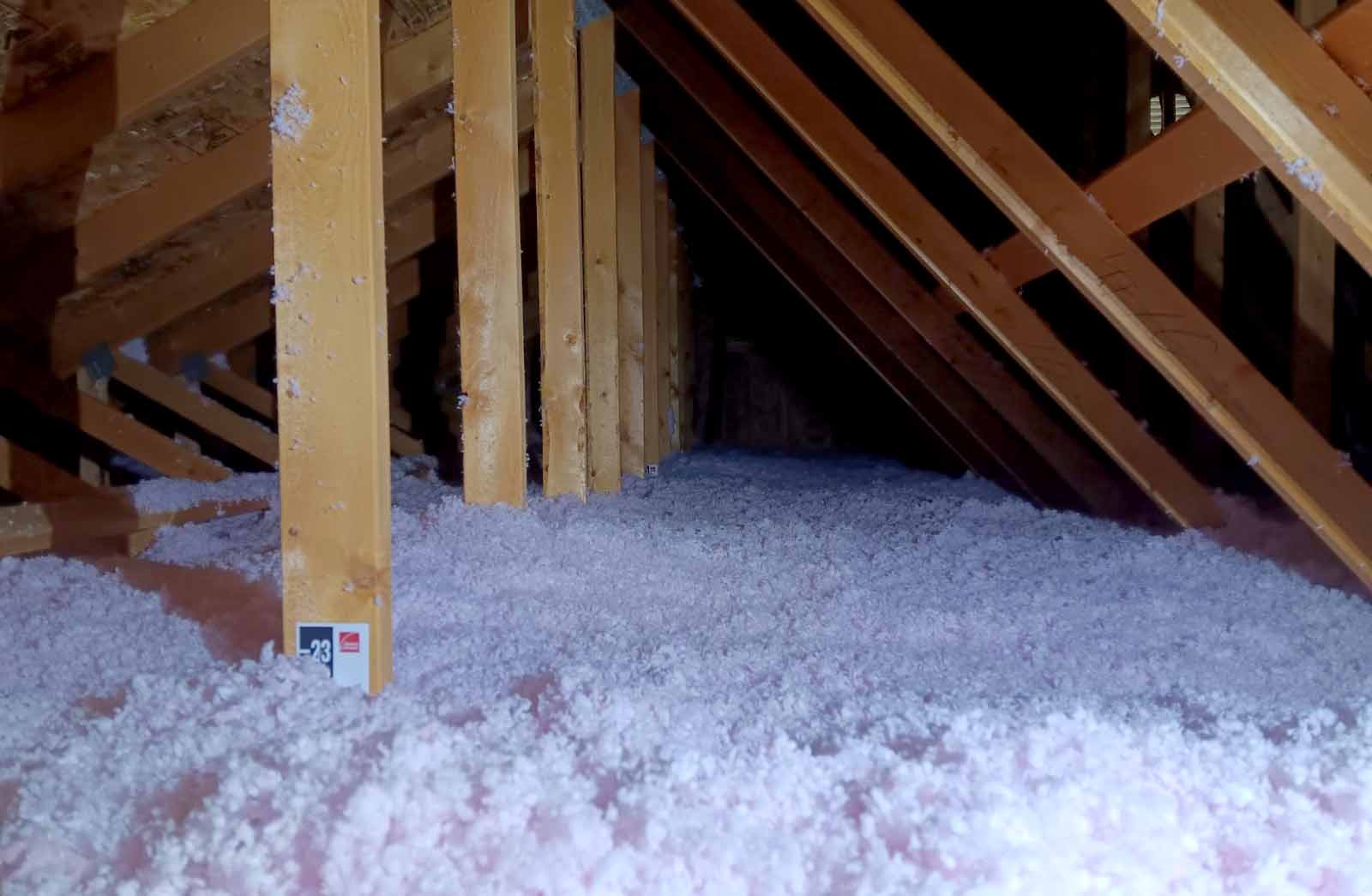 Cullen Insulation blown-in fiberglass insulation in attic space in Fargo, ND.